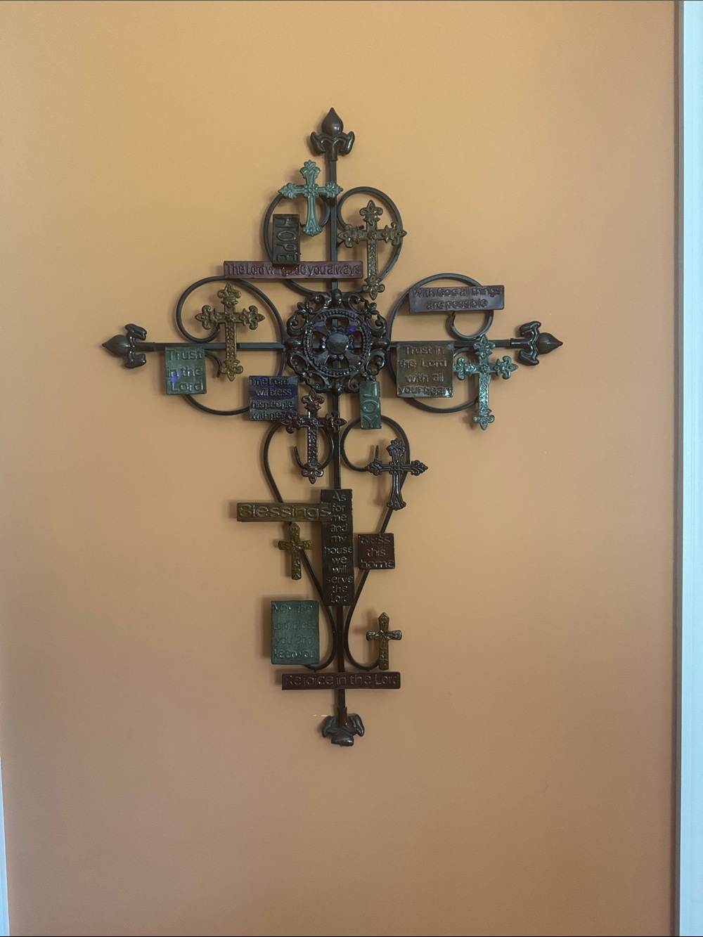 Antique-Style Metal Cross Wall Accent in Bronze and Patina